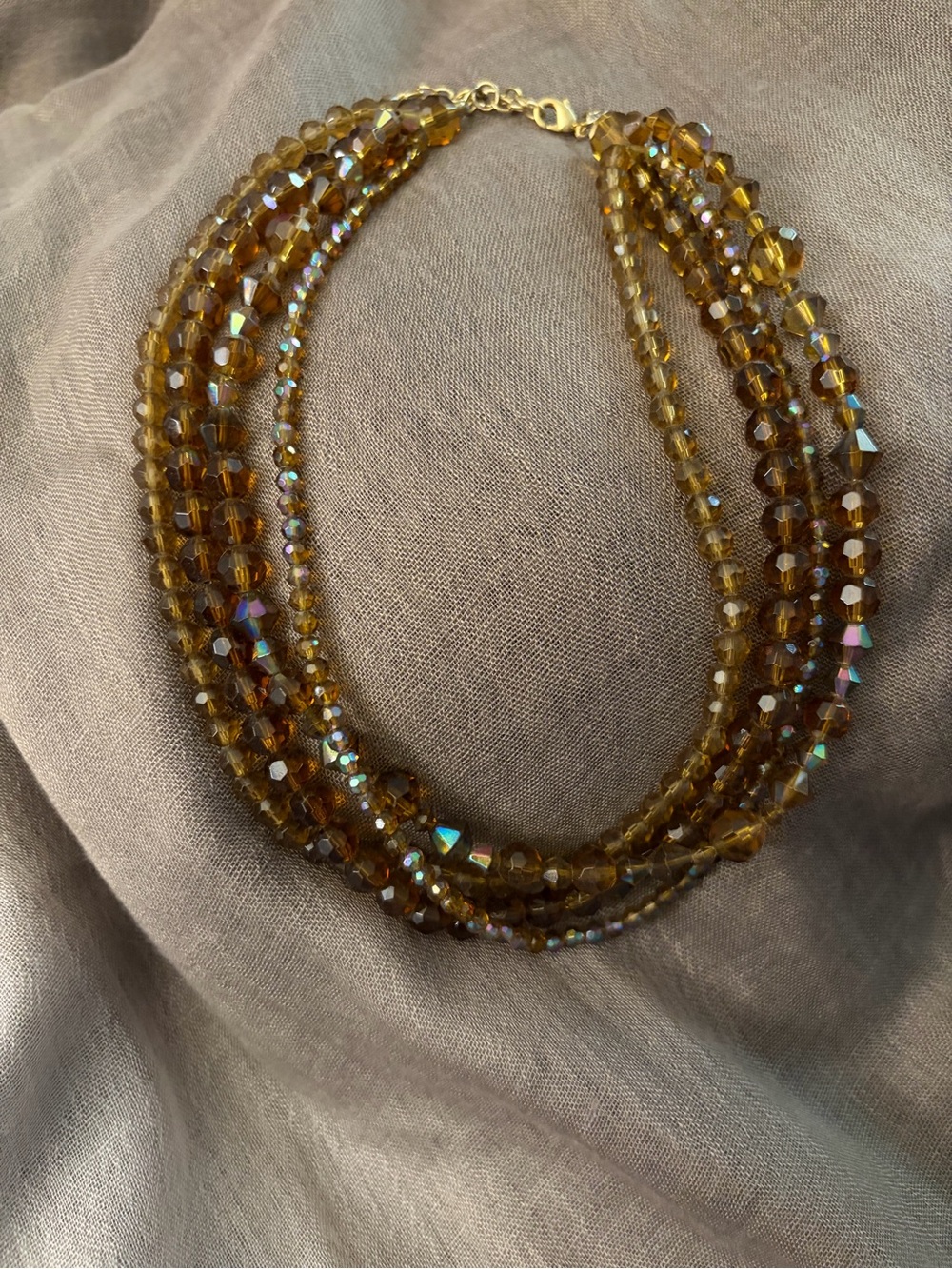 Multi-Strand Amber Glass Bead Necklace.  This resembles the 1940s style